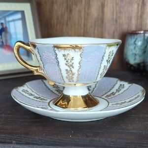 Luxurious Gold and White Teacup with Saucer